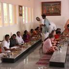 Devotees taking prasadam