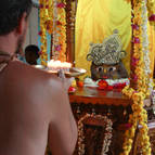 Giri Maharaja Offering Arati to Giriraja