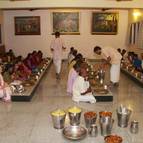 Devotees Honouring the Lord's Prasadam