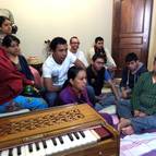 Devotees hearing hair-katha.