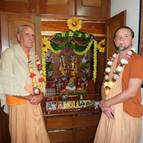 Srila Guru Maharaja and Giri Maharaja in front of the altar.